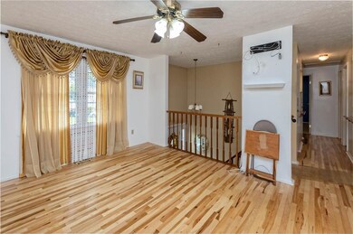 Living room with view of hallway leading to bedroo