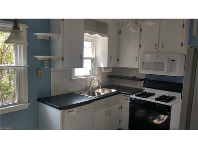 You will enjoy this bright and homey kitchen.