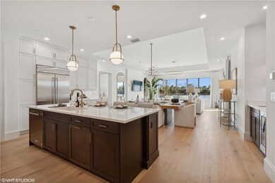 Kitchen featuring white cabinets, stainless steel 