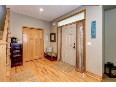 Spacious foyer has much natural light from the sid