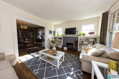 Bookshelves with window above on each of the firep