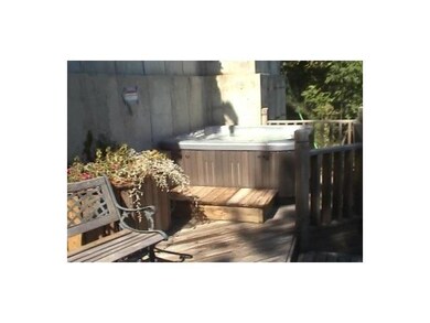 Exterior Front Hot tub behind house with entry to 