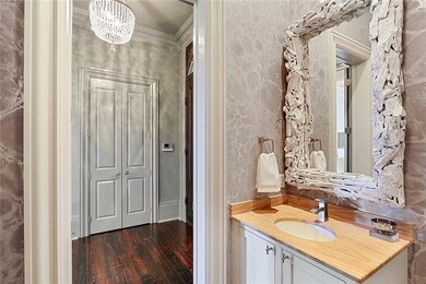 Powder room featuring custom wallpaper