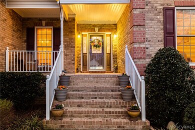 DEEP PORCH FOR RELAXING.  A VERY WELCOMING ENTRY.