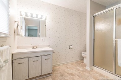 The en-suite master bathroom has a walk-in shower 