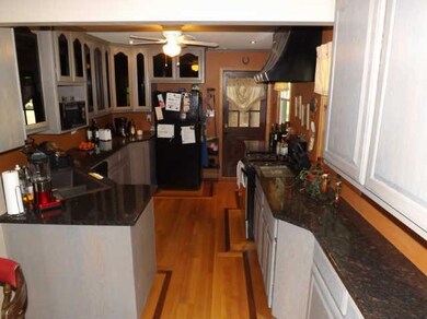 This state of the art kitchen boasts custom cabinets, pull out drawers, granite countertops, under cabinet lighting, hardwood floors and so much more...beautiful!!!