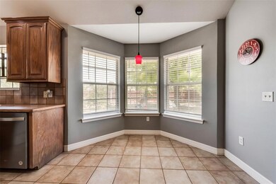 Dining area with bay windows and views to the  backyard
