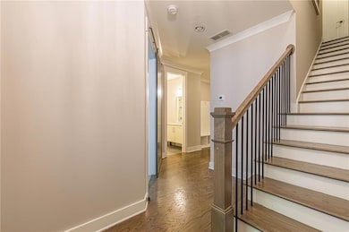 Stairway with baseboards, ornamental molding, wood