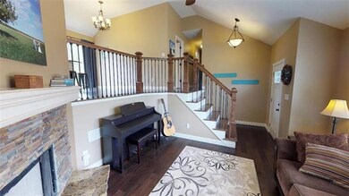 STACK STONE FIREPLACE IN LIVING ROOM & VAULT CEILINGS.