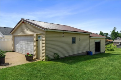 2 stall detached garage with 1 stall behind