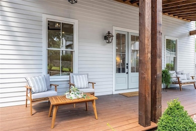 Comfy front porch for visiting with guests and watching the world go by!