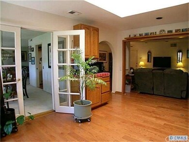 Kitchen opens to formal dining and family room.