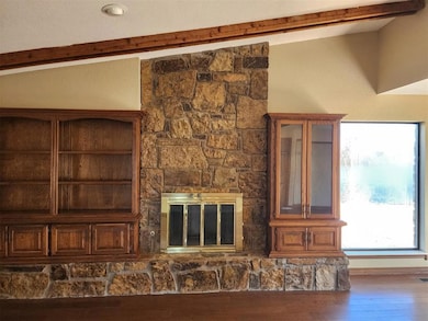 Details with beam ceiling and wood finished floors