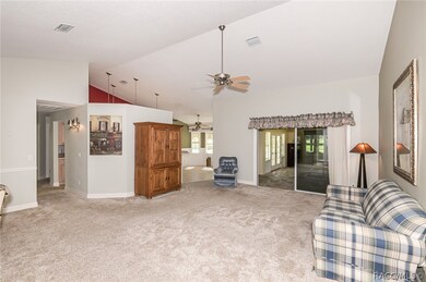 Main living area facing the kitchen and outside la
