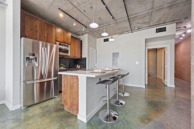 This angle highlights the kitchen’s flow into the
