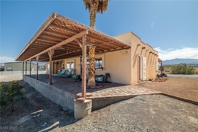 Back of property featuring a patio, a mountain vie