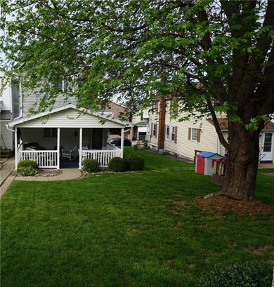 Nice rear yard and mature tree gives this back yar