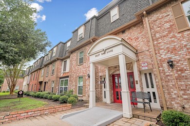 The entrance has a ramp, and a beautiful brick ext