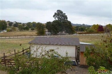 Single stall barn and covered hay storage.  Proper