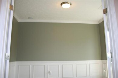 Elegant Office space with Crown Moulding, Built in speaker system, and wainsotting and chair rail...