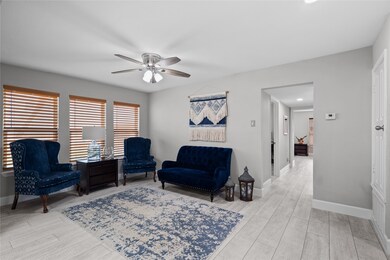 The living room has lots of large windows with nic