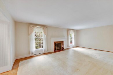 Living room has all hardwood floors.  The custom rug can stay with the house