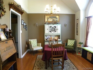 Dining Room with bamboo floor, palladian window, v