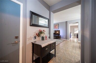 Hallway featuring light tile patterned floors and