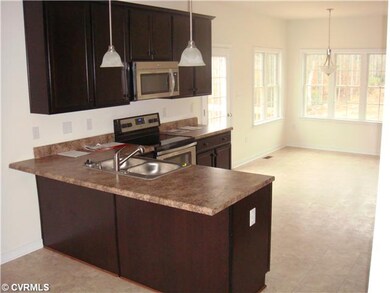 Kitchen -  Pictures are of a similar home and may 