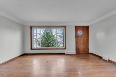 Empty room featuring light wood-type flooring