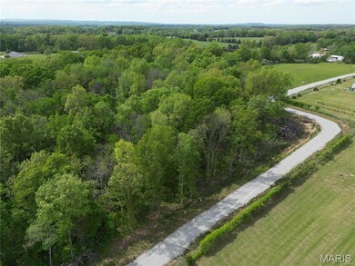 Aerial view of property and surrounding area