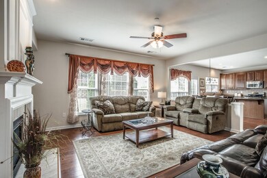 Family room with immediate access to the kitchen, breakfast nook and fenced level back yard. 