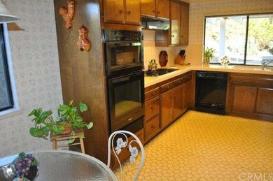 Kitchen has lots of cabinets for storage and count
