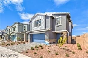 View of front of property featuring driveway, an a