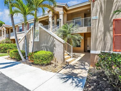 View of property with stairs