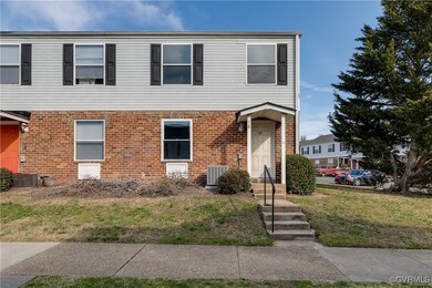 View of front of house with a front yard, cooling