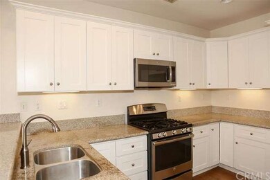 The stainless steel range features a gas cook top.