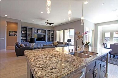 Over-sized kitchen island with custom granite and 