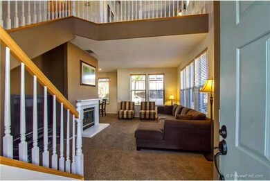 Spacious living room with a warm fireplace...