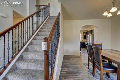 Stairway featuring dark hardwood / wood-style floo