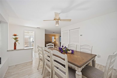 Dining Room inside front door with view into kitchen and living room.
