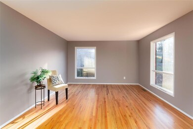 Another view of the Gleaming Wood Floors in the Living Room and Fresh and Pristine New Interior Paint!