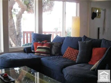 living room w/fireplace & large windows
