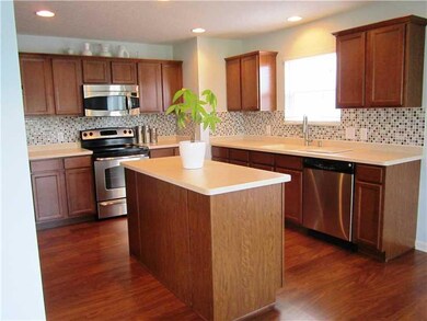 Kitchen. Updates include the ceramic tile backsplash and the Corean countertops.  You will love the center island.