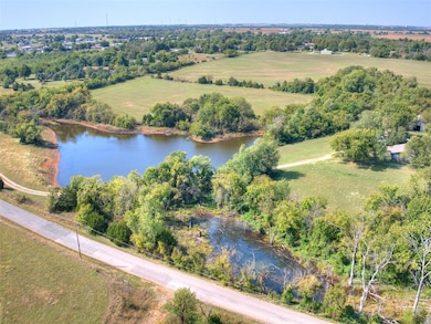 Overview of rural landscape featuring a nearby body of water
