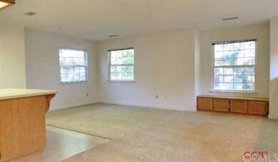 Open floor plan from kitchen to living area.