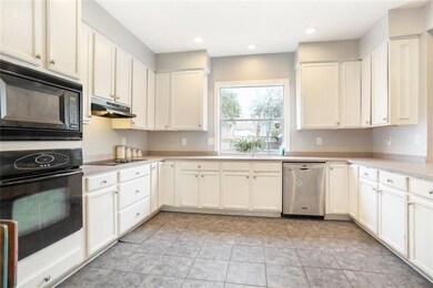  plenty of cabinetry and window overlooking back y