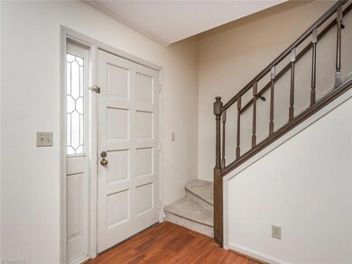 Main entrance opens up directly to living room.