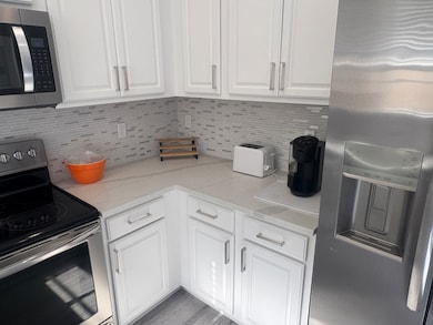 Kitchen w/white cabinets