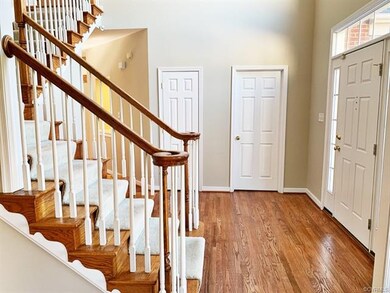 The Foyer offers a Neutral Paint Palette, Chandeli